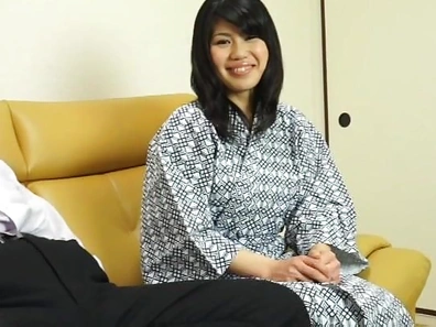 Hot Asian babe gives a nice handjob on a sofa