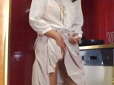 Seductive Mature Japanese Woman Spices Up Kitchen Encounter