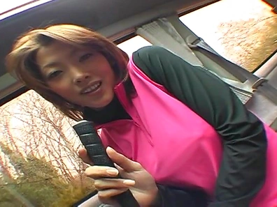 Busty teen plays with cock while in the car